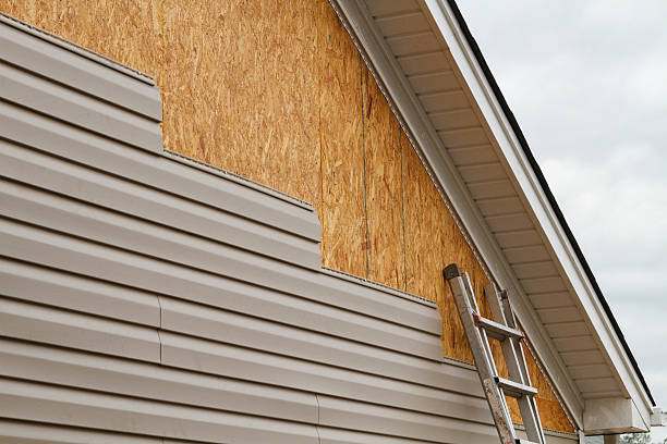 Professional Storm Damage Siding Repair technician working in Brooklyn, OH